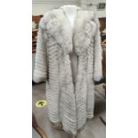 A modern full length pale fur coat, herringbone pattern size 12