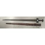 A 19th century Mid Eastern/Sudanese sword in embossed leather scabbard, overall length of sword 97cm