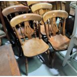 A 19th century set of 7 matched beech kitchen chairs with fiddle backs