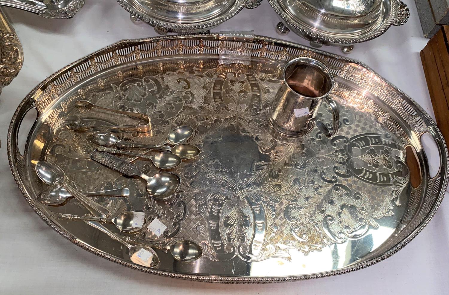 An oval silver plated gallery tray, a silver plated christening mug etc