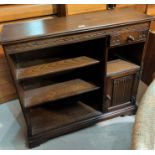 An "Old Charm" reproduction bookcase with cupboard and drawer