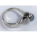 A George Jensen silver ring designed by V Torun Bülow-Hübe, with oval moonstone in raised 'Y'