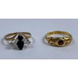 An 18 carat hallmarked gold Victorian style dress ring set garnet, 2 gm; a 9 carat hallmarked gold