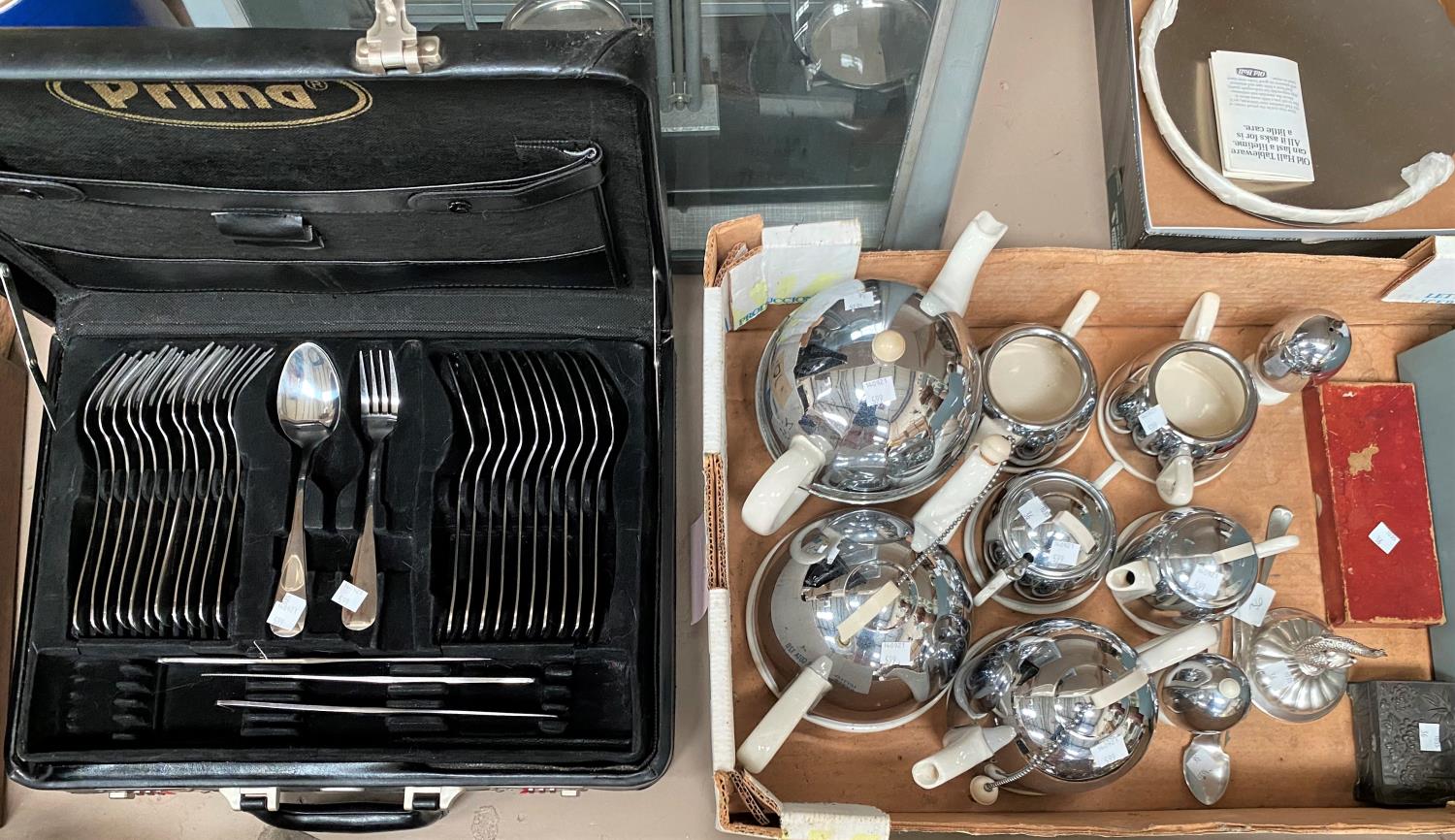 A selection of Art Deco 'Mushroom' teapots in chrome and white pottery; a canteen of stainless steel