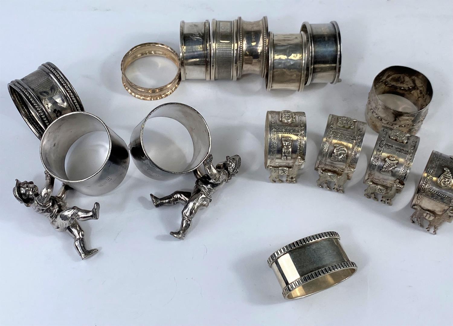 6 hallmarked silver napkin rings, various dates, 2; 4oz South American napkin rings with llamas in