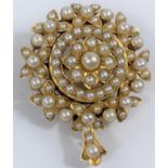 A Victorian yellow metal brooch/pendant set seed pearls, unmarked, tests as 15 carat, 11.2 gm