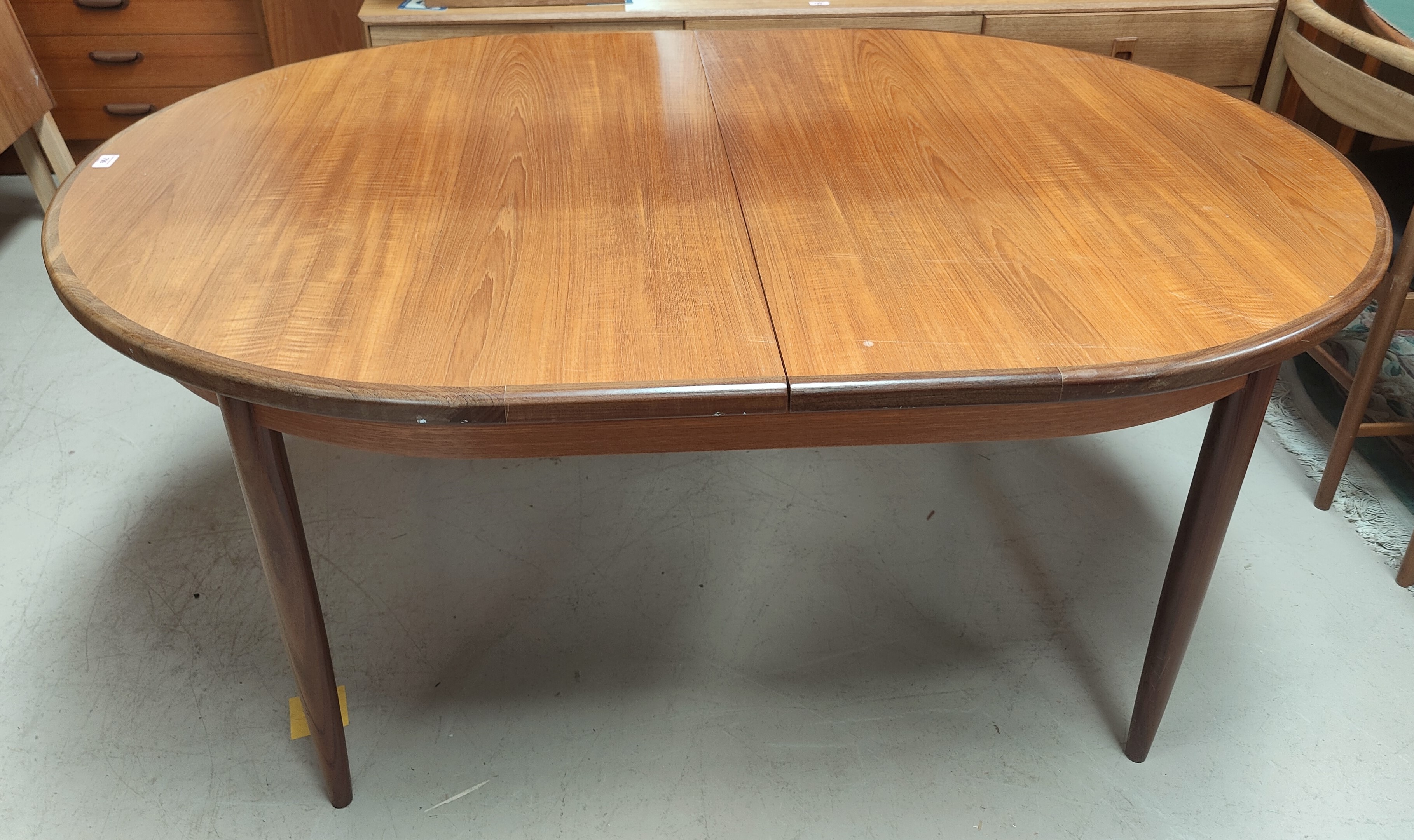 A mid century G-Plan oval extending teak dining table with integral leaf L163 (unextended)