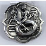 A George Jensen silver brooch designed by Arno Malinowski: mermaid riding on a water horse in waves,