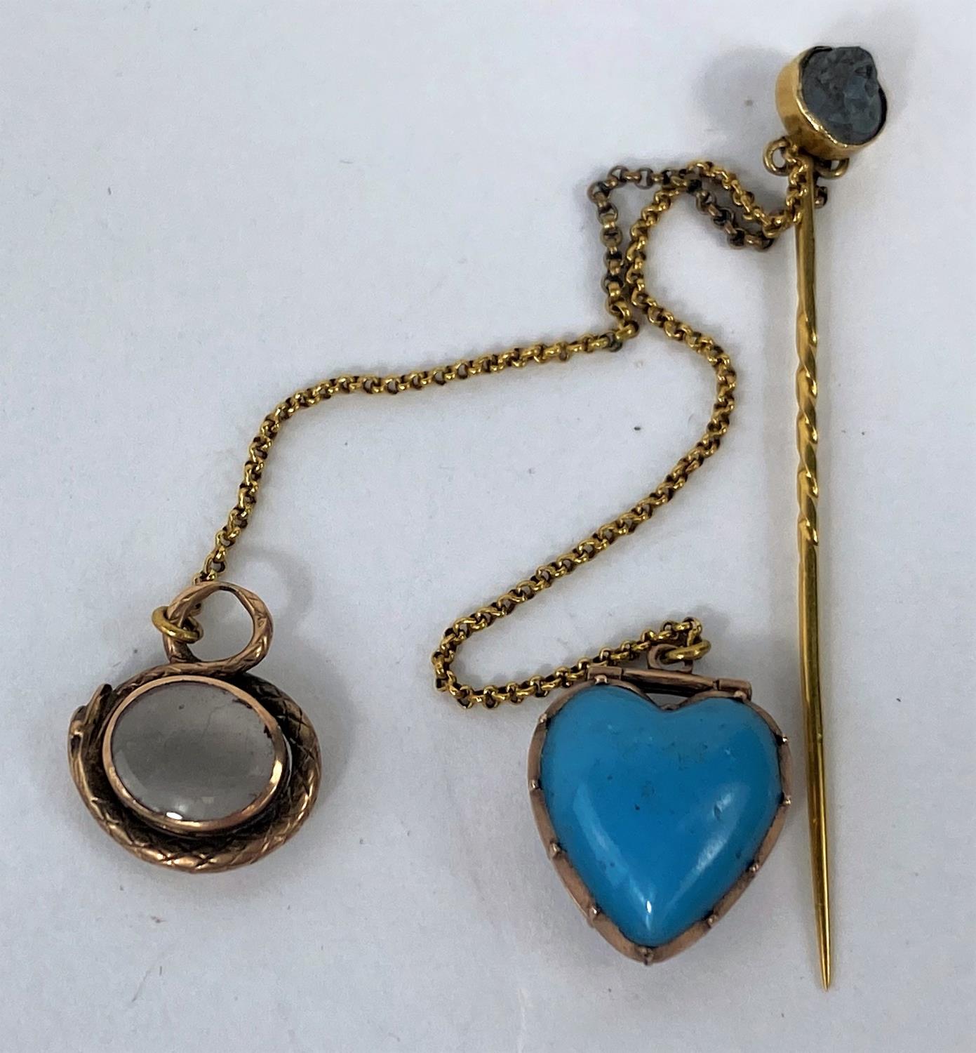 A yellow metal stick pin with cameo, a small locket and magnifier, set turquoise stone