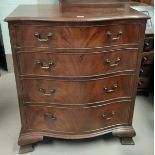 A reproduction figured mahogany 5 height chest of drawers with serpentine front