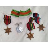 A WWII Burma Star, 2 others and a Defence Medal