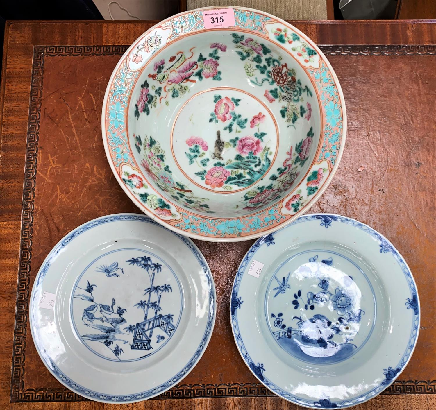 A Chinese famille rose bowl, d. 29cm (restored) and 2 Chinese blue and white plates