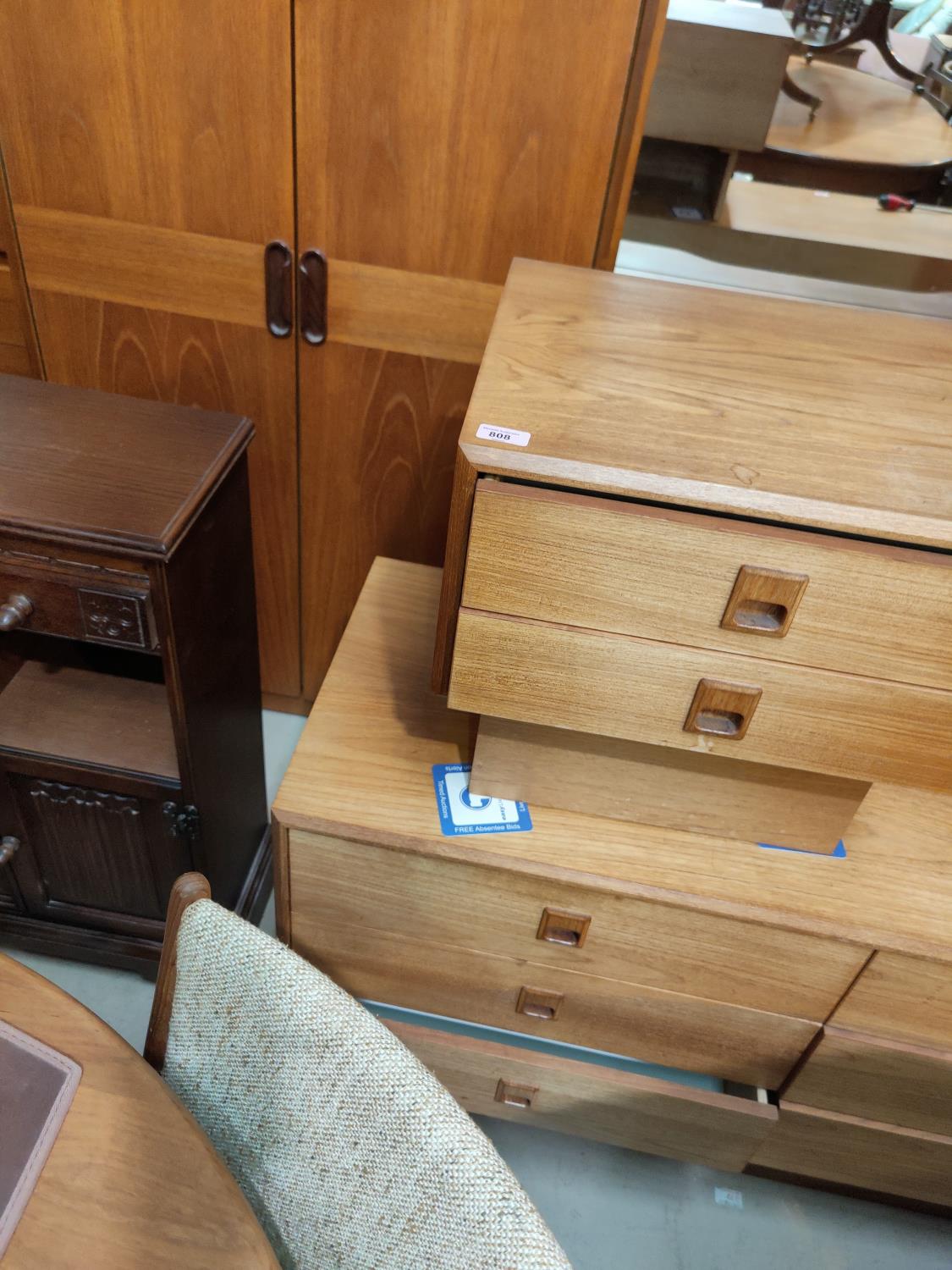 A teak veneered bedside chest, two teak headboards