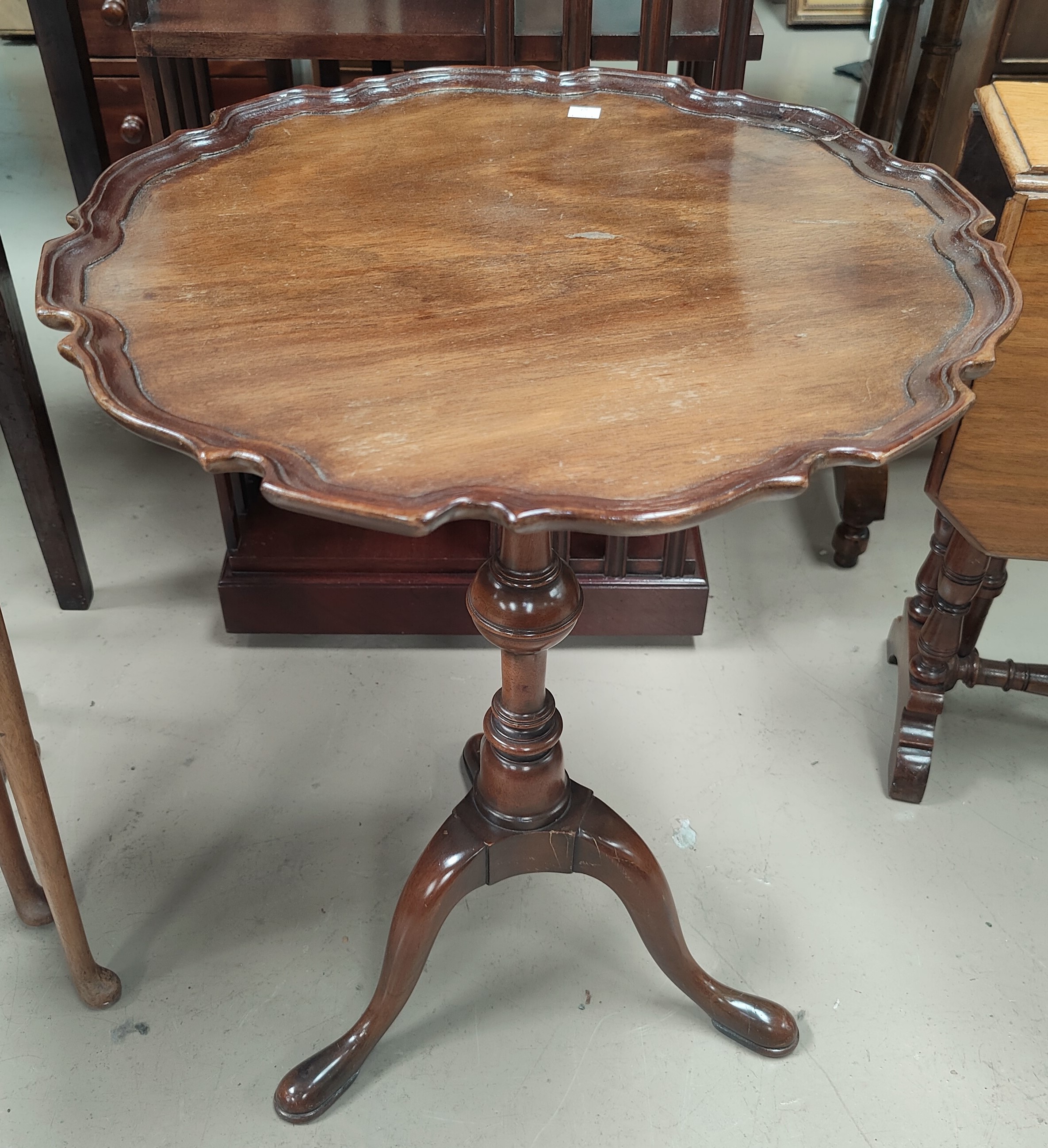 A Georgian style mahogany armchair; a reproduction mahogany wine table; a reproduction demi-lune