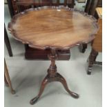 A Georgian style mahogany armchair; a reproduction mahogany wine table; a reproduction demi-lune