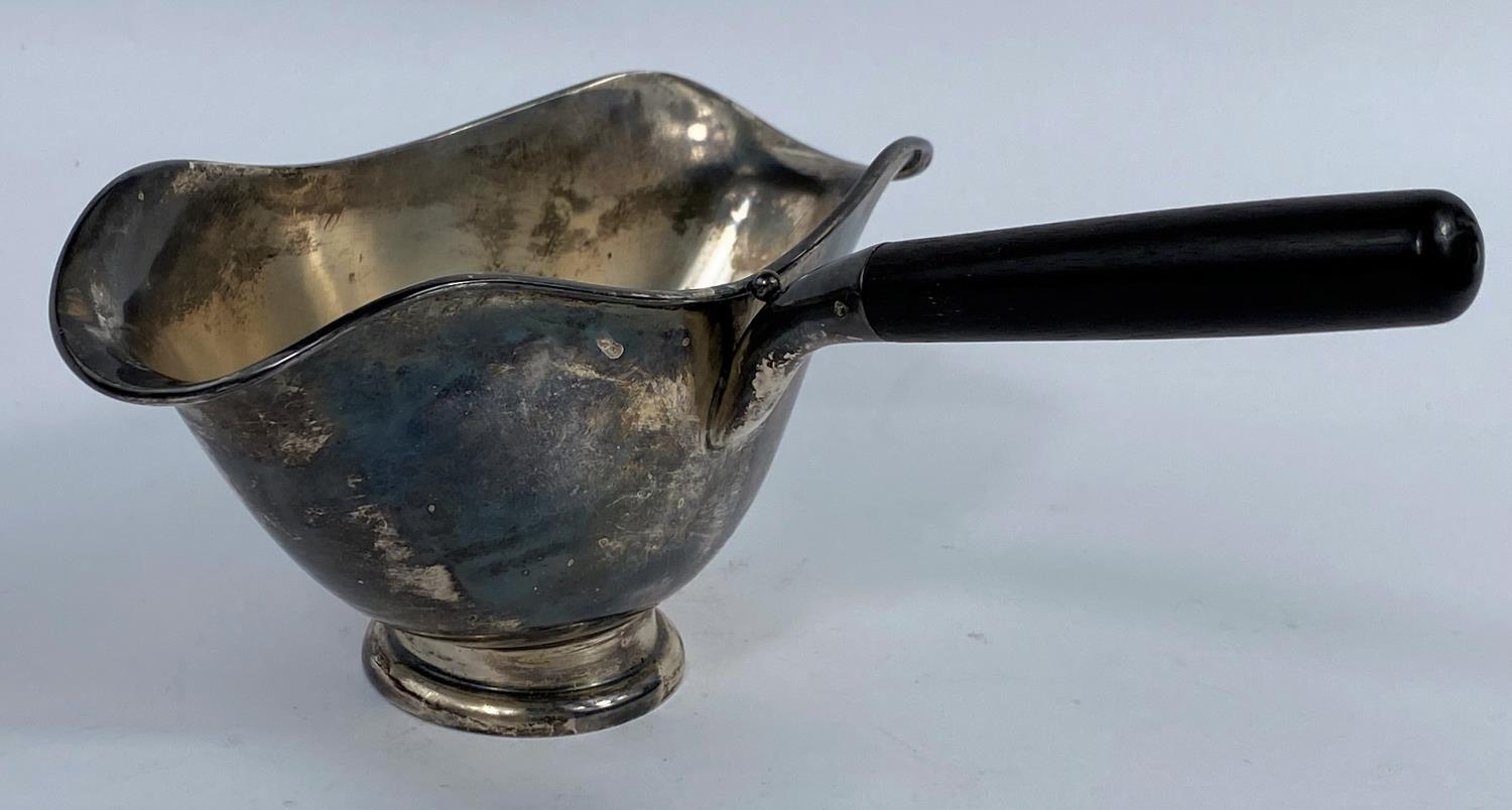 A Swedish white metal double lipped sauce boat with side handle, three crowns mark, 4oz, 130gms.