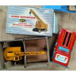 A Dinky Supertoys 971 Coles Mobile Crane, original box; a tinplate 1d slot chocolate dispenser.