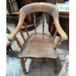 A 19th century beech and elm spindle back armchair; a rush seat ladder back armchair