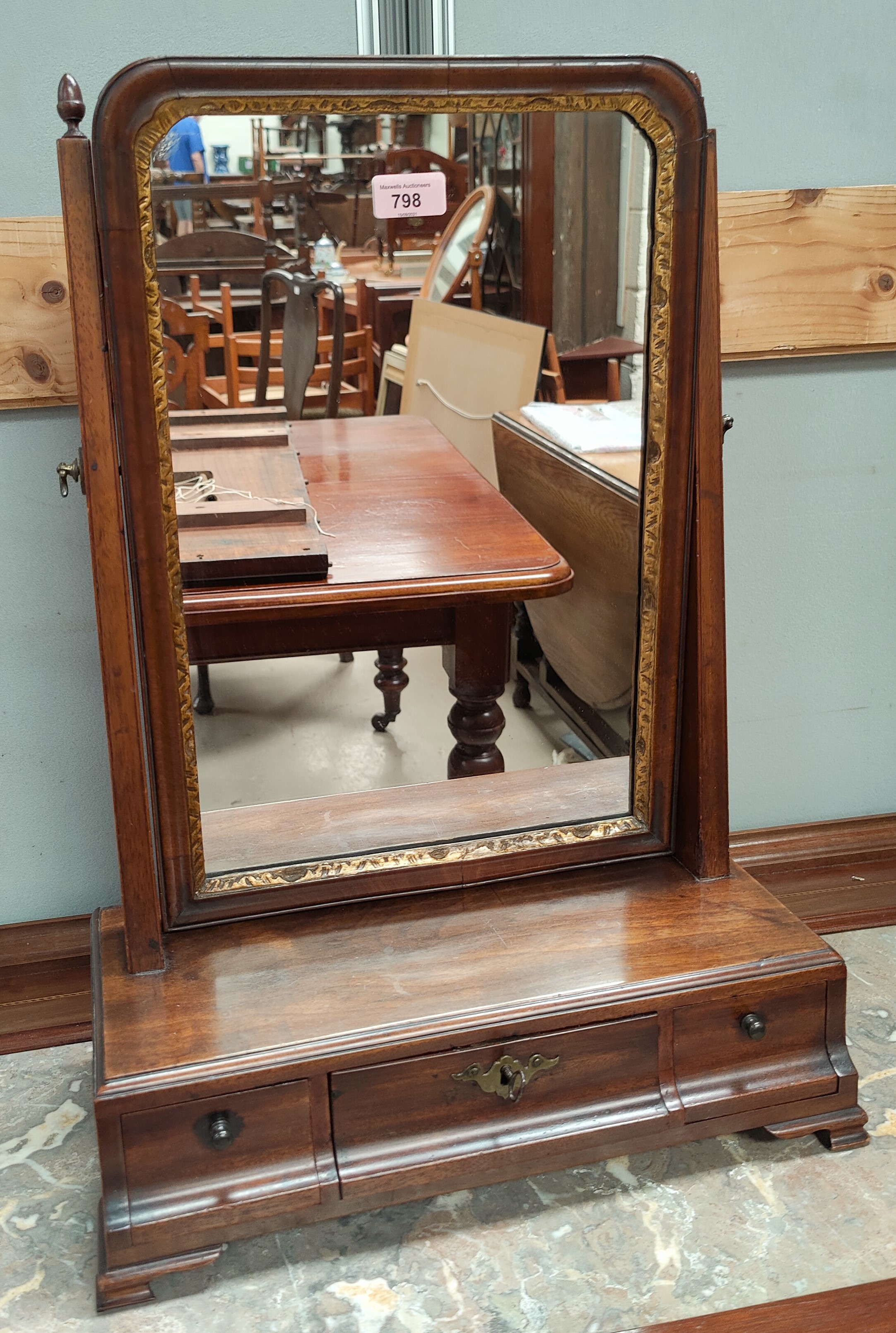 A Georgian style dressing table mirror in walnut free standing frame with drawers to base