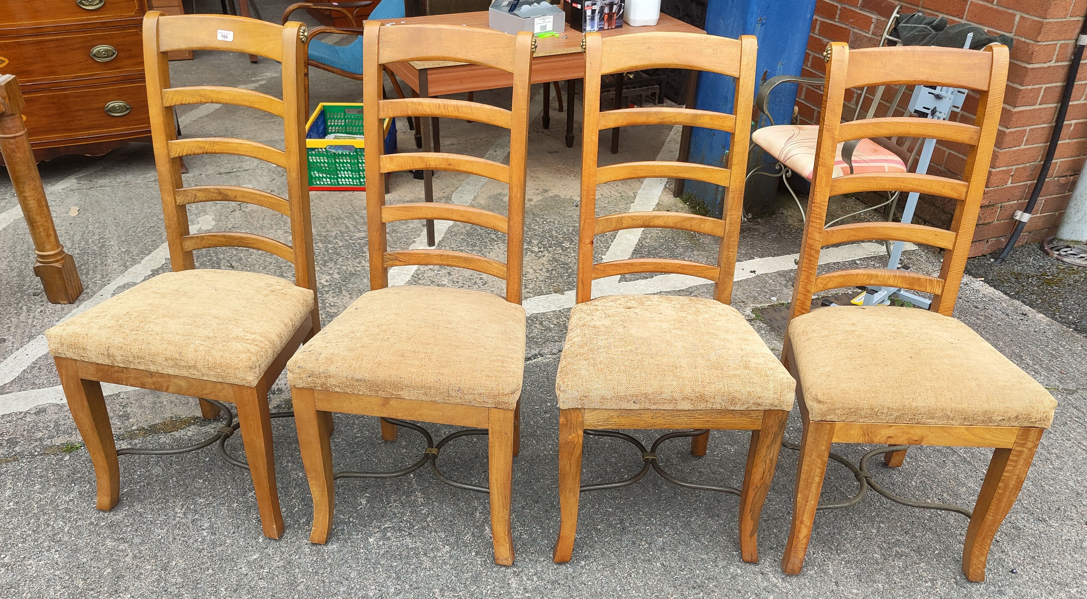 A modern lightwood set of four chairs.