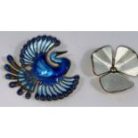 A Norwegian blue enamelled sterling brooch of a mythical bird by David Andersen; a similar floral