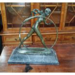 AnArt Decostyle bronze group of a naked girl with large hoop, on grey marble plinth, height 44cm