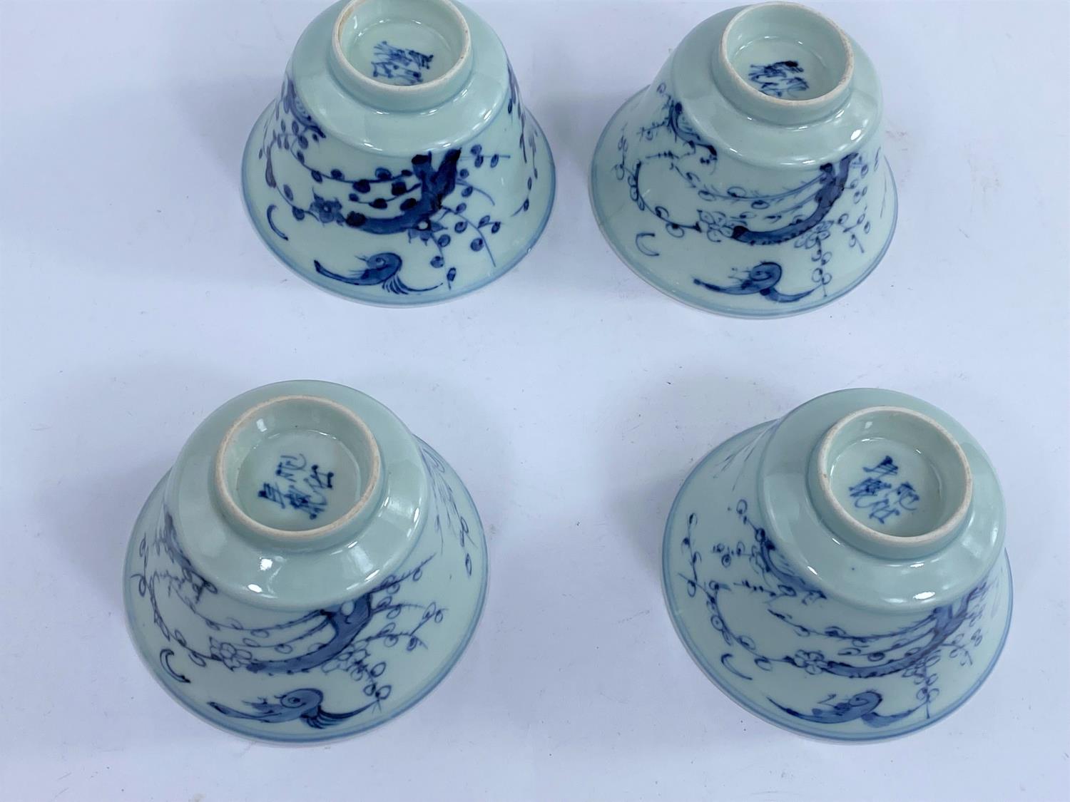 Four Chinese blue and white tea bowls with Prunus blossom decoration with birds, a character mark to - Image 3 of 4