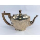 A classical style hall marked silver monogrammed tea pot Sheffield 1925, 19oz (590 gms)