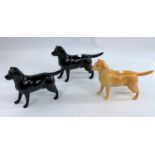 Three Beswick labrador dogs, two black and one yellow, number: 1548