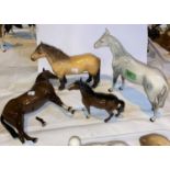 A Four Beswick horses: Bois Roussel racehorse grey 701, Bois Roussel racehorse brown 701 (leg a.