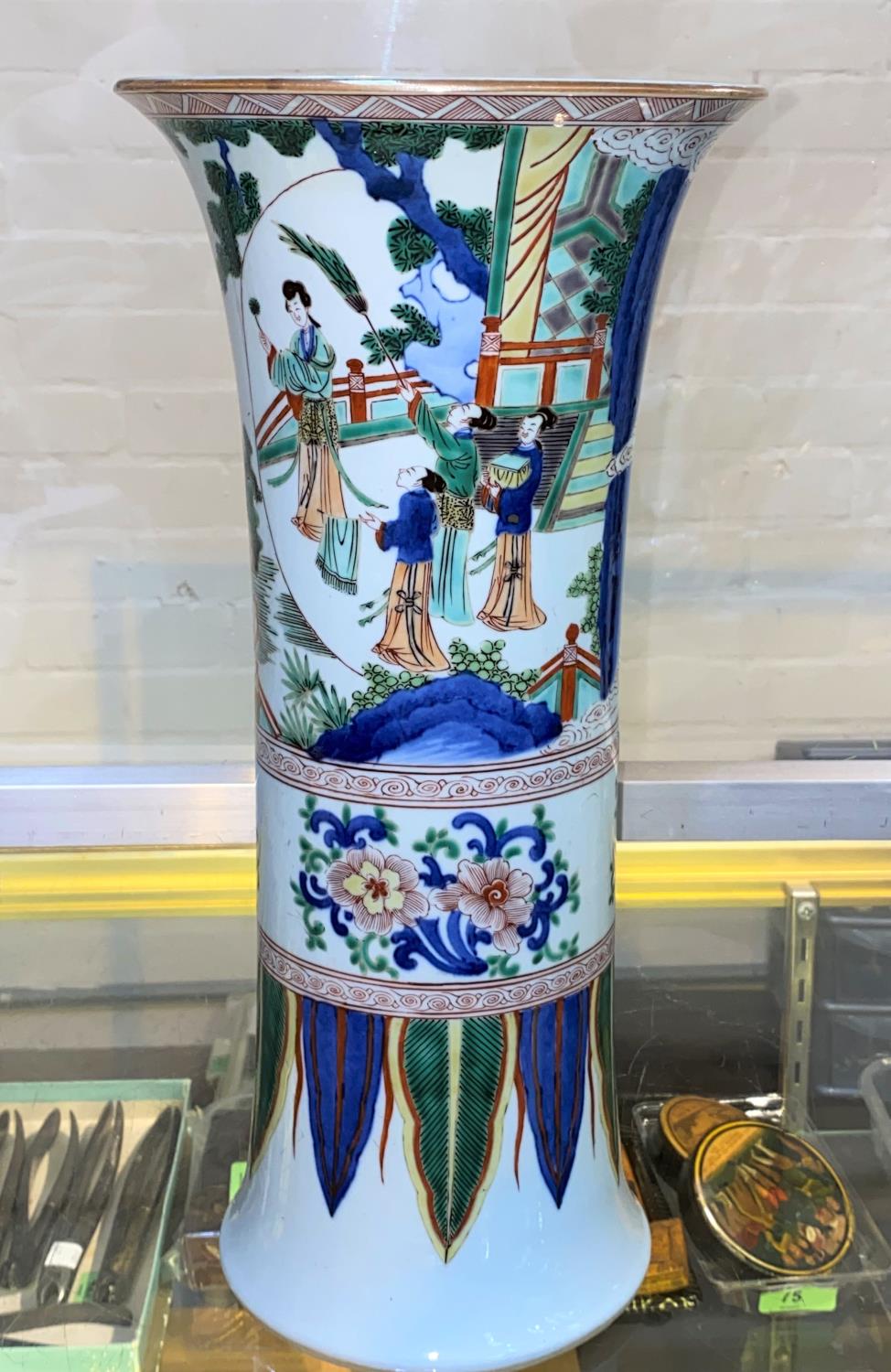 A Chinese famille verte cylindrical vase with flared rim, depicting a domestic scene, height