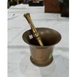 A large 19th century bronze pestle and mortar, 14cm diameter