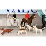 A Beswick hunting group: Huntsman 1501, Huntswoman 1730, a pack of four dogs and a fox