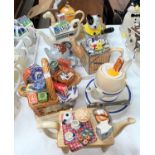 9 Novelty teapots including washing machine, camel, dog, basket etc