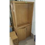 A modern veneered wall unit with shelf and cupboard below and a similar small unit.