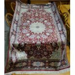 A modern red ground, hand knotted Persian rug, length 184 cm.