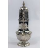 A Georgian crested sugar dredger with pierced domed top and circular foot, London 1733, 5.6 oz,