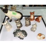 A large beswick siamese cat and a selection of Beswick kittens (8) and a small Royal Doulton group