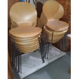 A modern set of 18 stacking chairs in chrome and moulded plywood, in the manner of Arne Jacobsen for