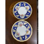 A pair of Cauldon China for Tiffany & Co New York no 3157, with blue and gilt borders with flowers