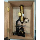 An early 20th century brass microscope by Armes & Cycles 18cm