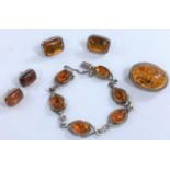 A part suite of amber and white metal including necklace and earrings etc