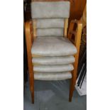 A set of four mid century Danish style designer stacking chairs with light wood frames and a