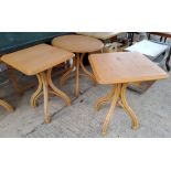 Three modern bentwood tables, two square one circle (bases slight a.f)