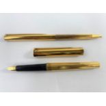 A vintage S.T. Dupont silver gilt fountain pen and ball point with 18ct gold nib red and blue