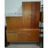 A 1970's Dutch teak desk/side cabinet of modular form in 3 sections, 130cm wide