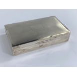 A hallmarked silver engine turned cigarette box, Birmingham date mark worn