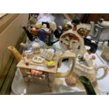 8 Novelty teapots - The Tailor of Gloucester musical teapot, gorilla, clock face, sewing machine etc