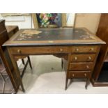 A mahogany desk with single side drawers and green leather effect top