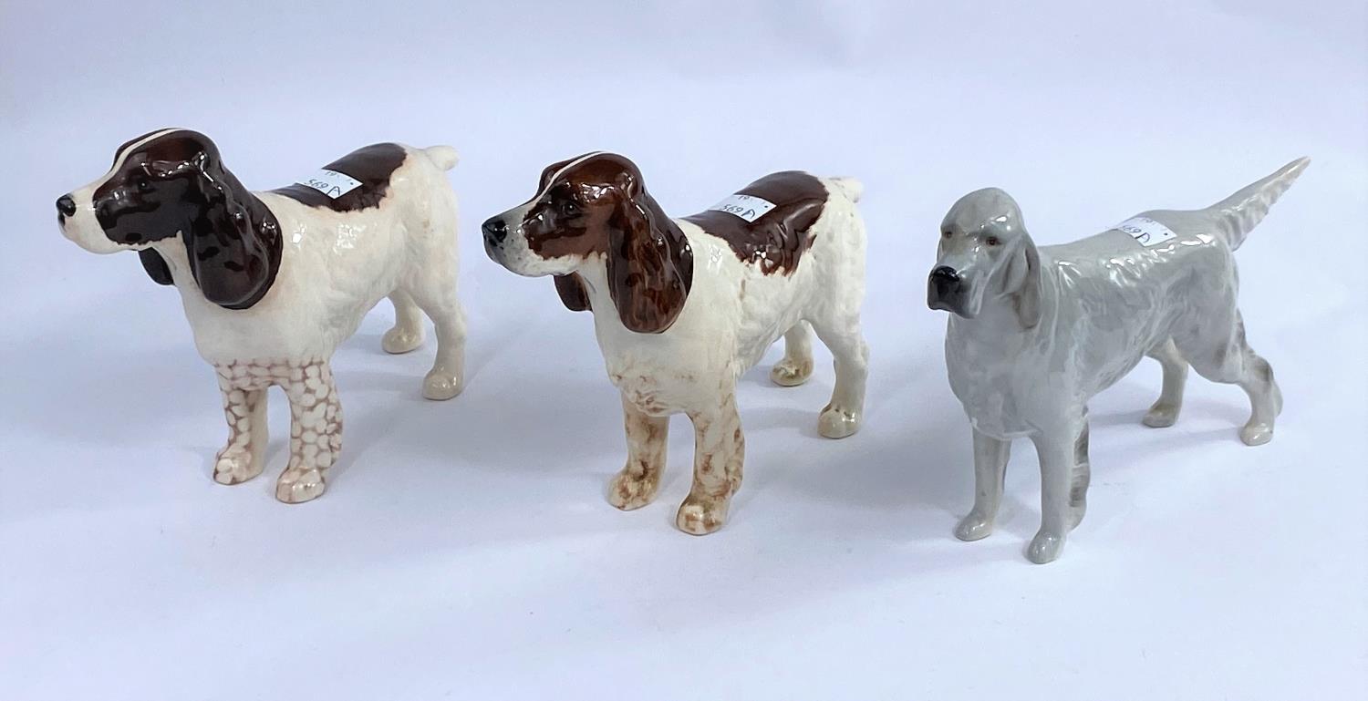 Three Beswick dog figures, English setter Bayldone Baronet, grey gloss 973, two Cocker Spaniels 967